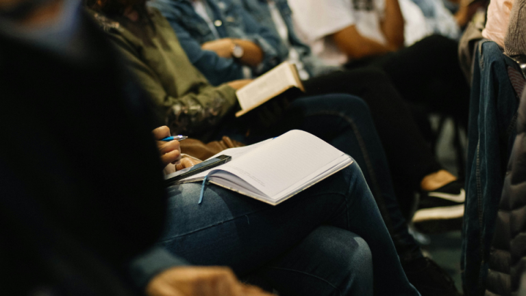 woman reading book in bible study groups