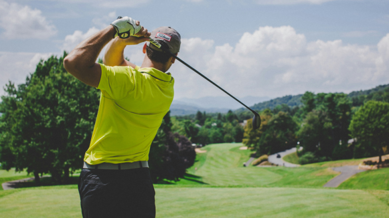 A man playing golf