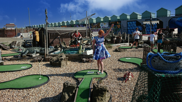 a person standing next to a playground